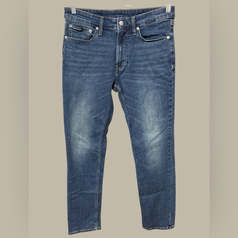 Calvin Klein men’s size 32W 32L slim fit jeans medium wash denim excellent